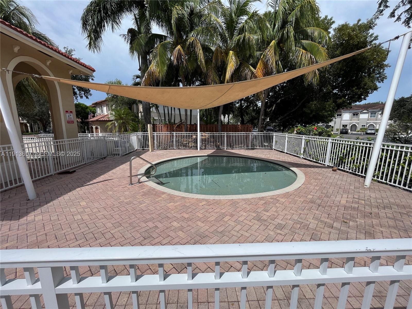 4929 Southwest 140th Terrace, Unit 5 Miramar, FL 33027 - Photo 33 of 43 swimming pool view with a seating space