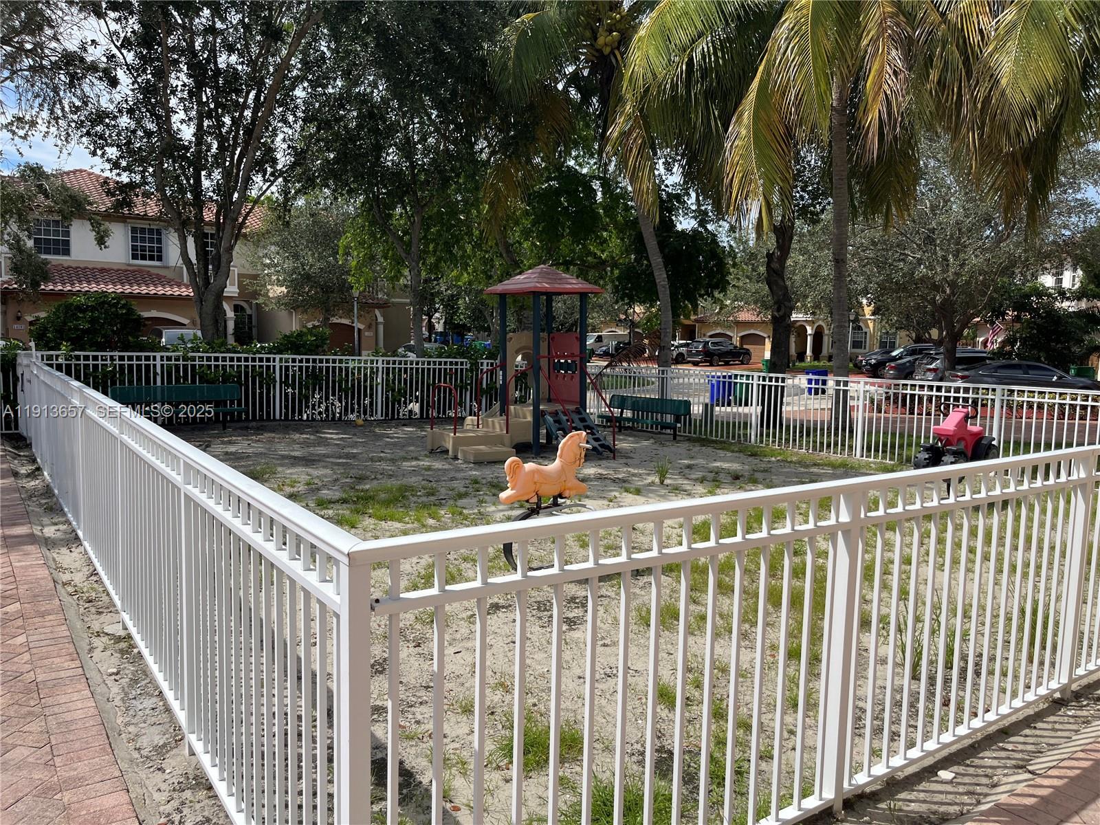 4929 Southwest 140th Terrace, Unit 5 Miramar, FL 33027 - Photo 35 of 43 a view of a chair and tables in the balcony