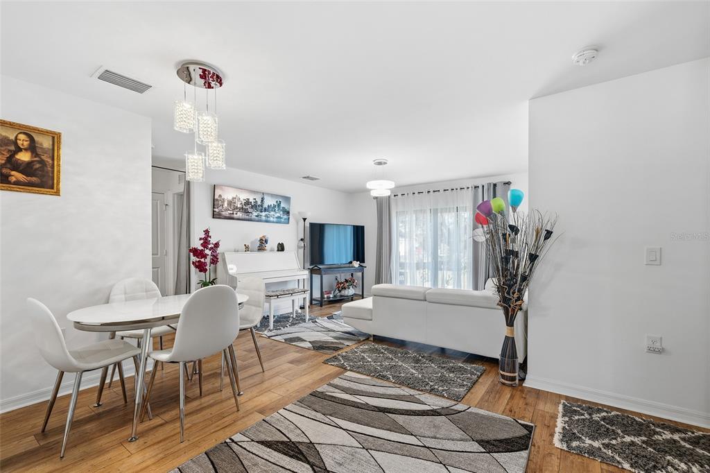 1304 Goshen Road North Port, FL 34288 - Photo 11 of 39 a living room with furniture and wooden floor
