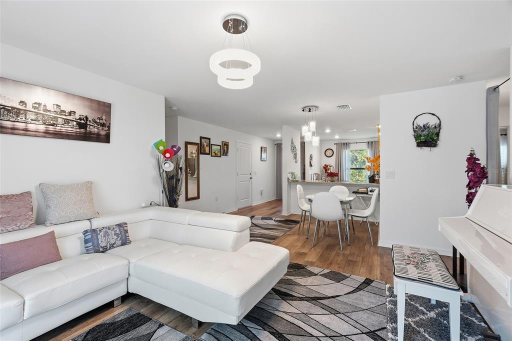 1304 Goshen Road North Port, FL 34288 - Photo 12 of 39 a living room with furniture and a clock