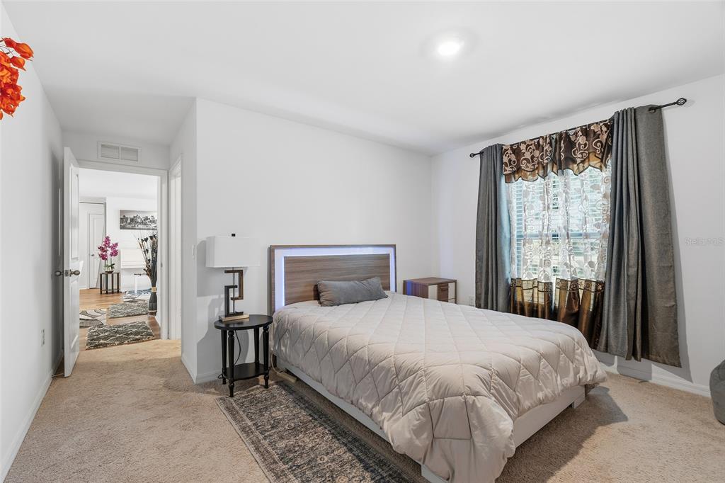 1304 Goshen Road North Port, FL 34288 - Photo 13 of 39 a bedroom with a bed and a window