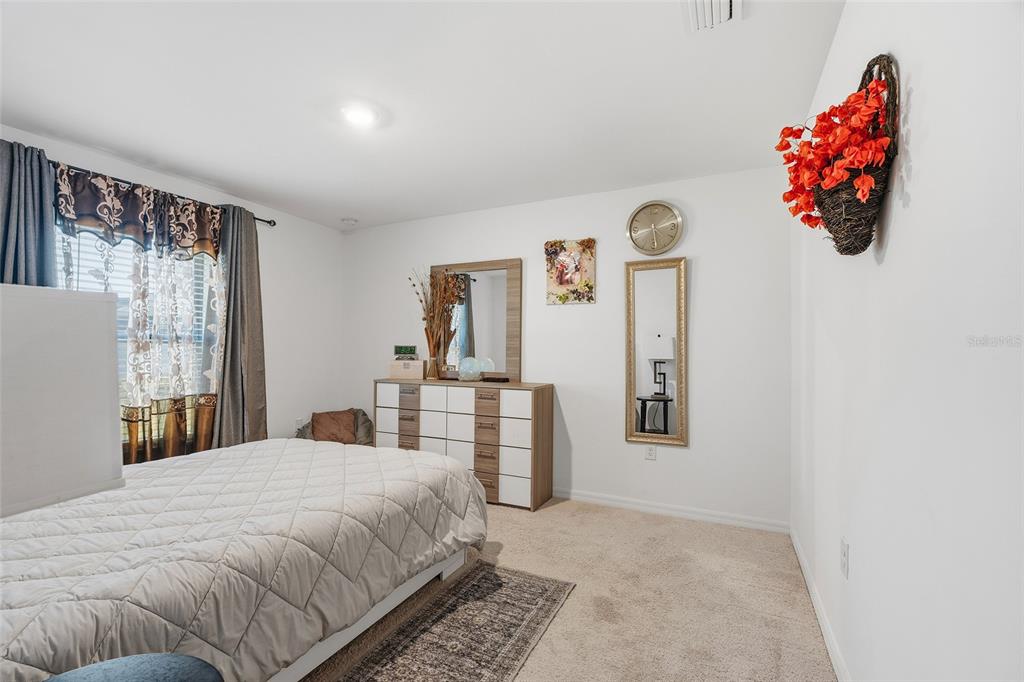 1304 Goshen Road North Port, FL 34288 - Photo 14 of 39 a bedroom with a bed and a window