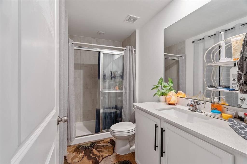 1304 Goshen Road North Port, FL 34288 - Photo 15 of 39 a bathroom with a sink a toilet and shower