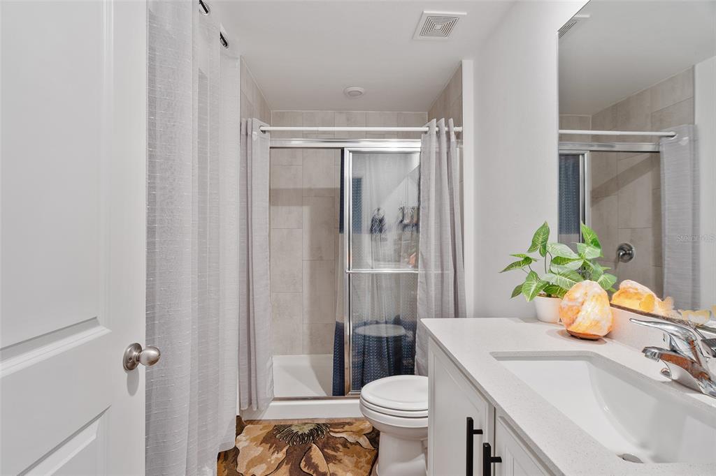 1304 Goshen Road North Port, FL 34288 - Photo 16 of 39 a bathroom with a sink toilet and shower