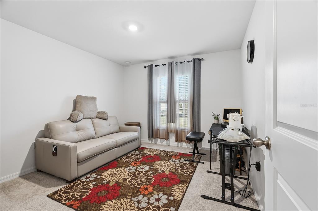 1304 Goshen Road North Port, FL 34288 - Photo 19 of 39 a living room with furniture and a rug