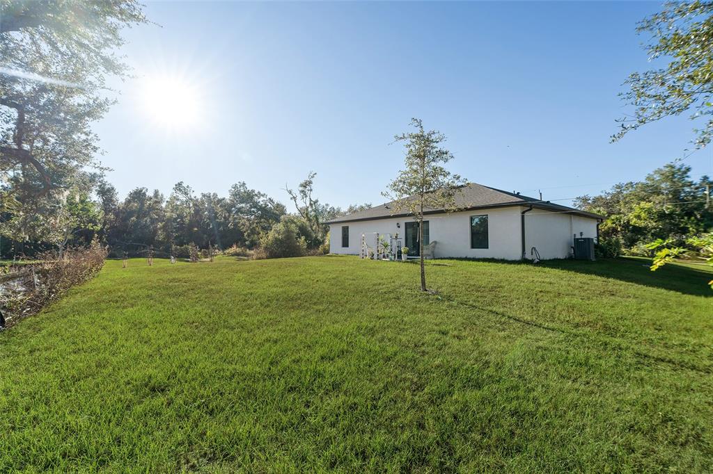1304 Goshen Road North Port, FL 34288 - Photo 29 of 39 a front view of house with yard and green space