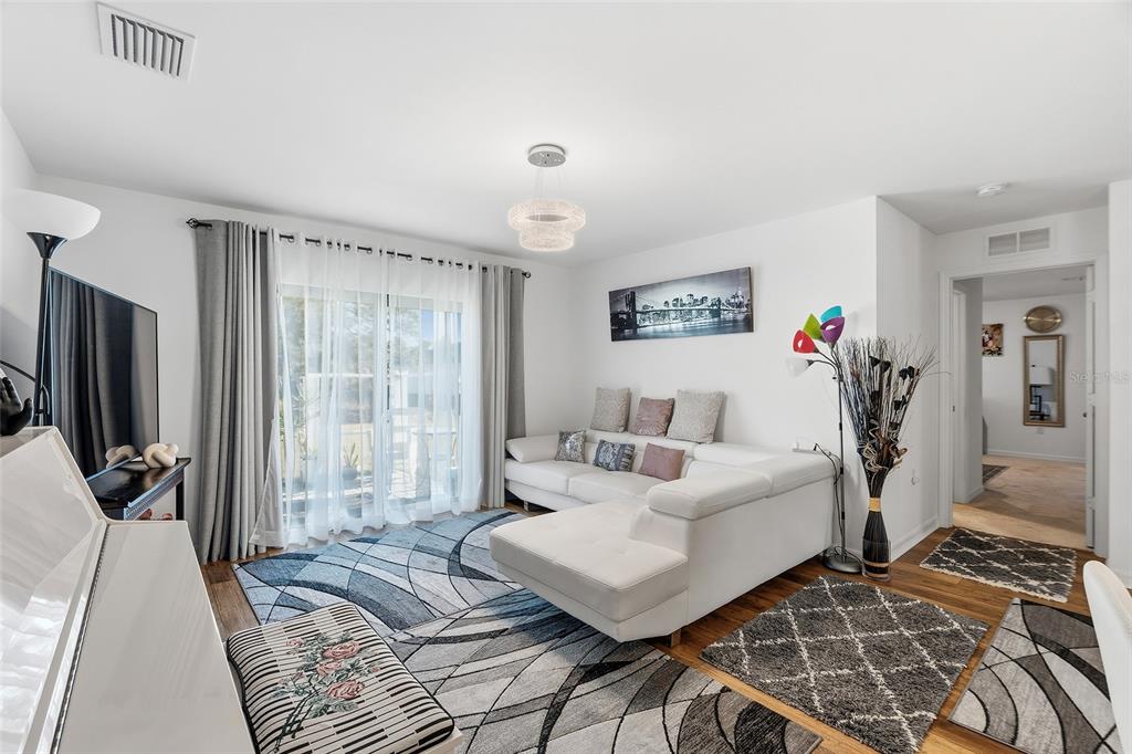 1304 Goshen Road North Port, FL 34288 - Photo 8 of 39 a bedroom with a bed and a flat tv screen on the dresser