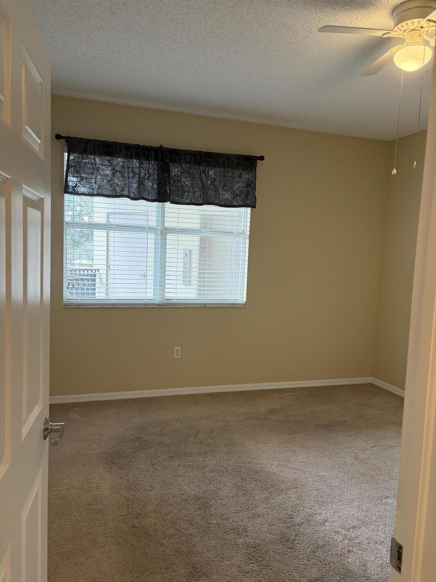 27 Royal Palm Way, Unit 304 Boca Raton, FL 33432 - Photo 14 of 26 an empty room with a window