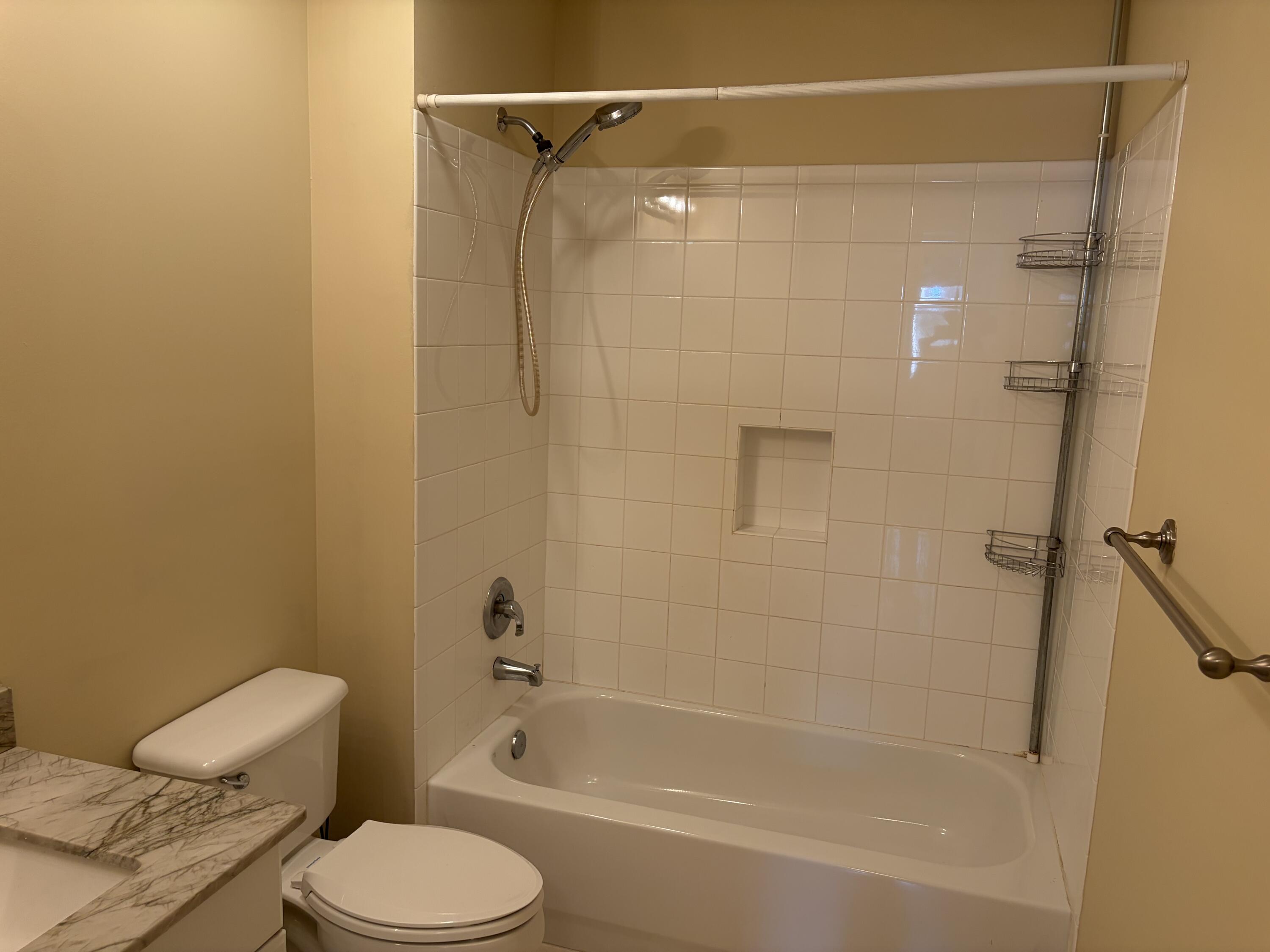 27 Royal Palm Way, Unit 304 Boca Raton, FL 33432 - Photo 16 of 26 a view of a bathroom with a tub and toilet