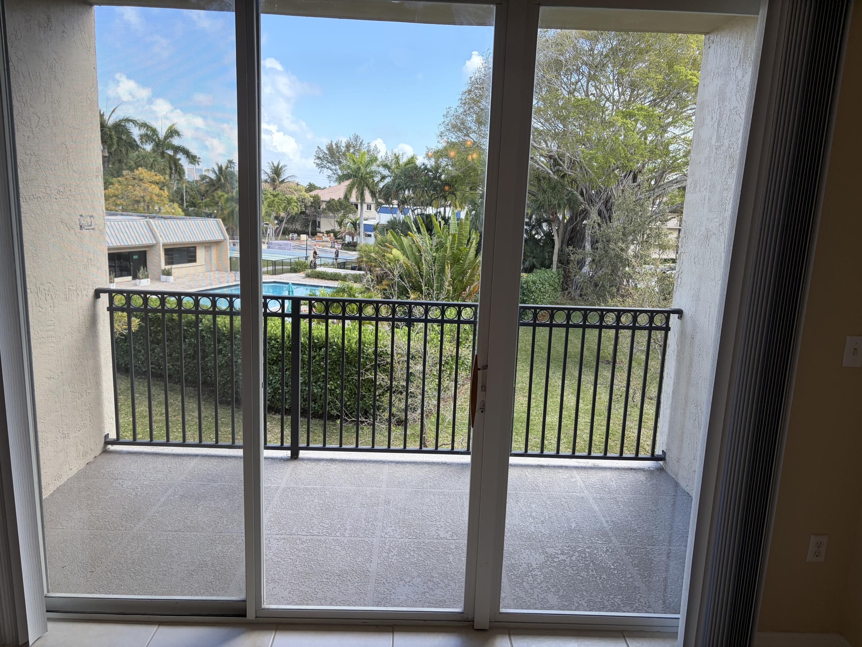 27 Royal Palm Way, Unit 304 Boca Raton, FL 33432 - Photo 6 of 26 a view of a glass door with a from a window