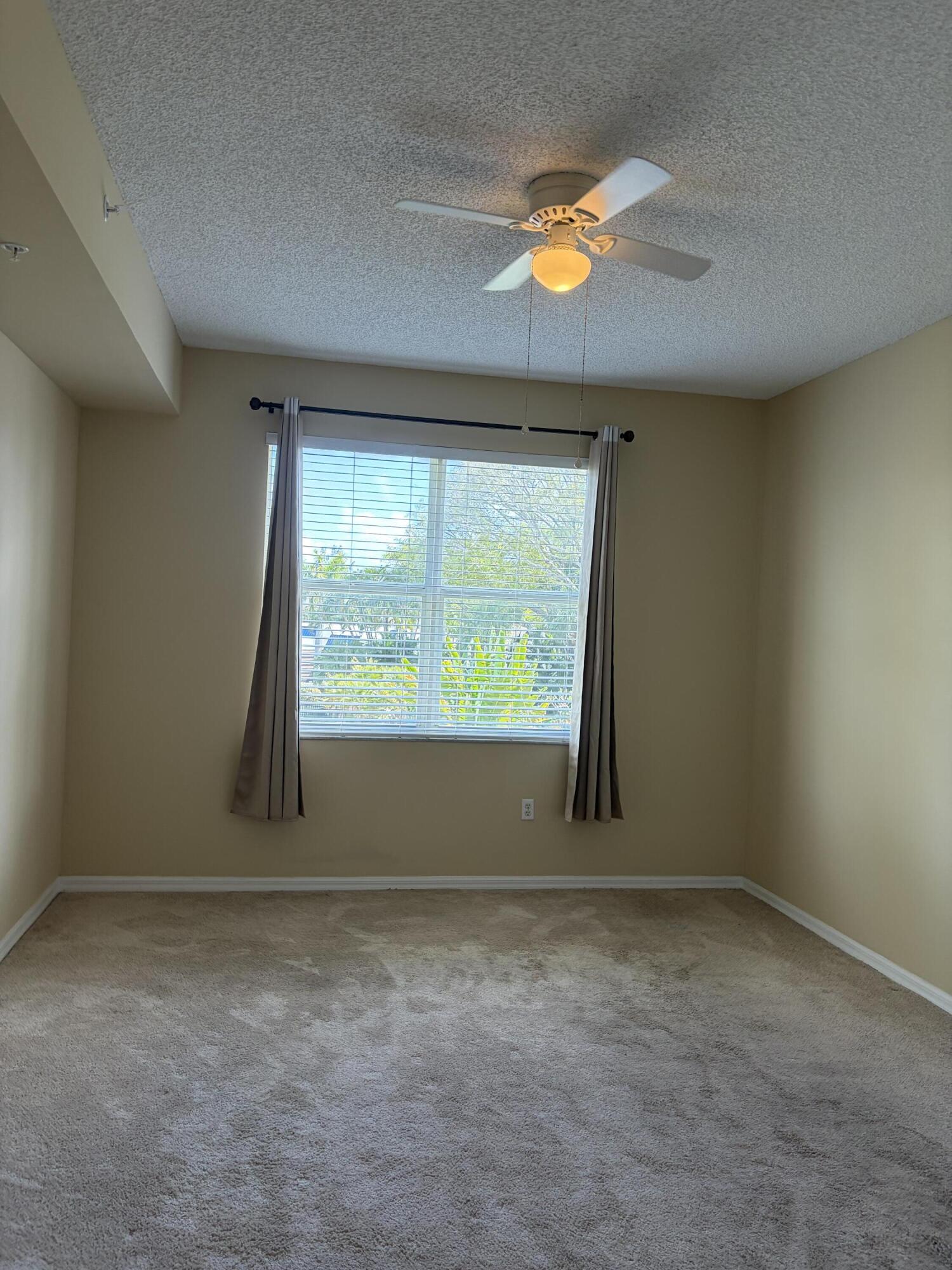 27 Royal Palm Way, Unit 304 Boca Raton, FL 33432 - Photo 9 of 26 an empty room with a window