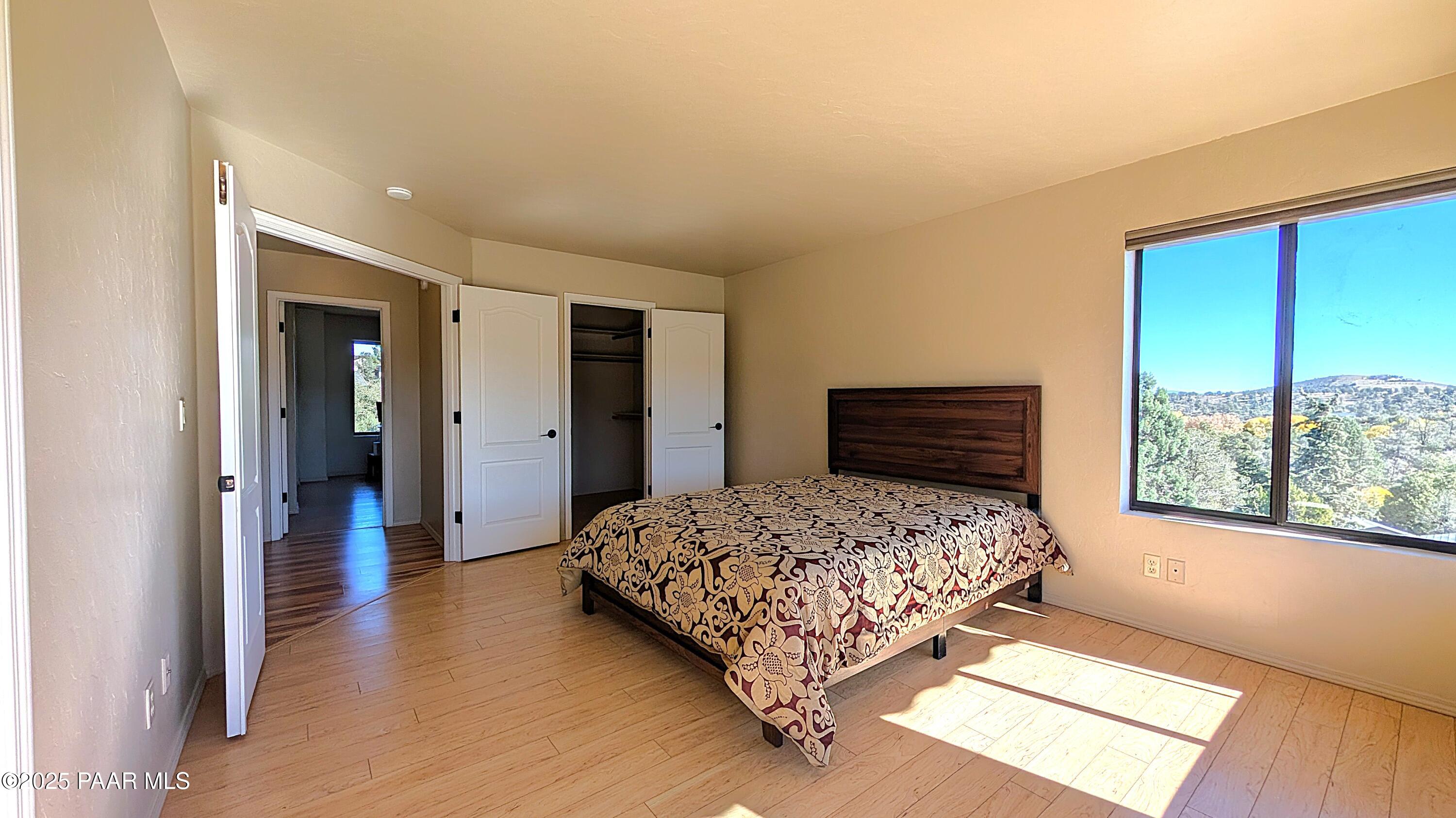 4911 Hornet Drive Prescott, AZ 86301 - Photo 11 of 29 a bedroom with a bed and a large window