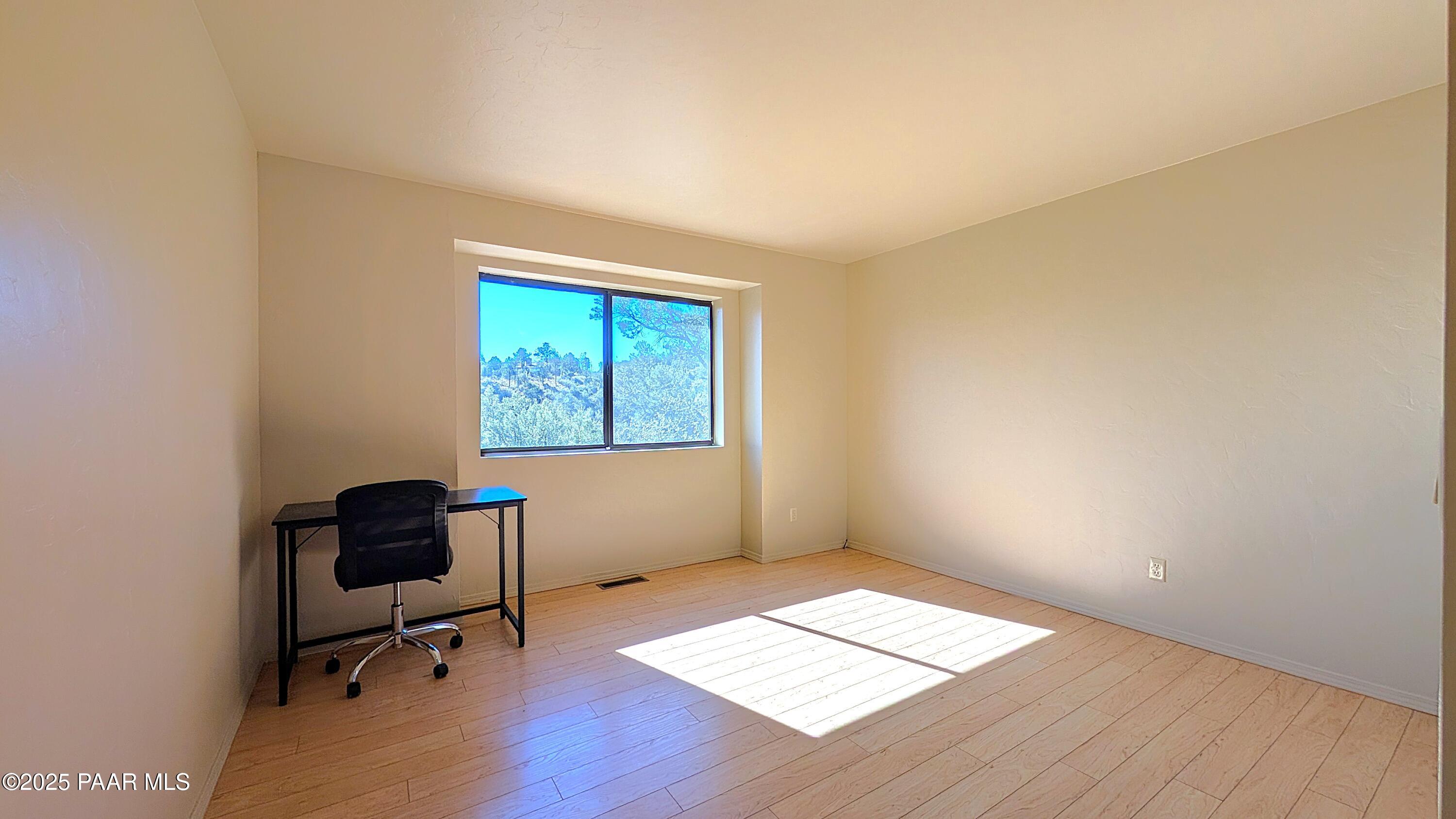 4911 Hornet Drive Prescott, AZ 86301 - Photo 14 of 29 a view of workspace with wooden floor and windows