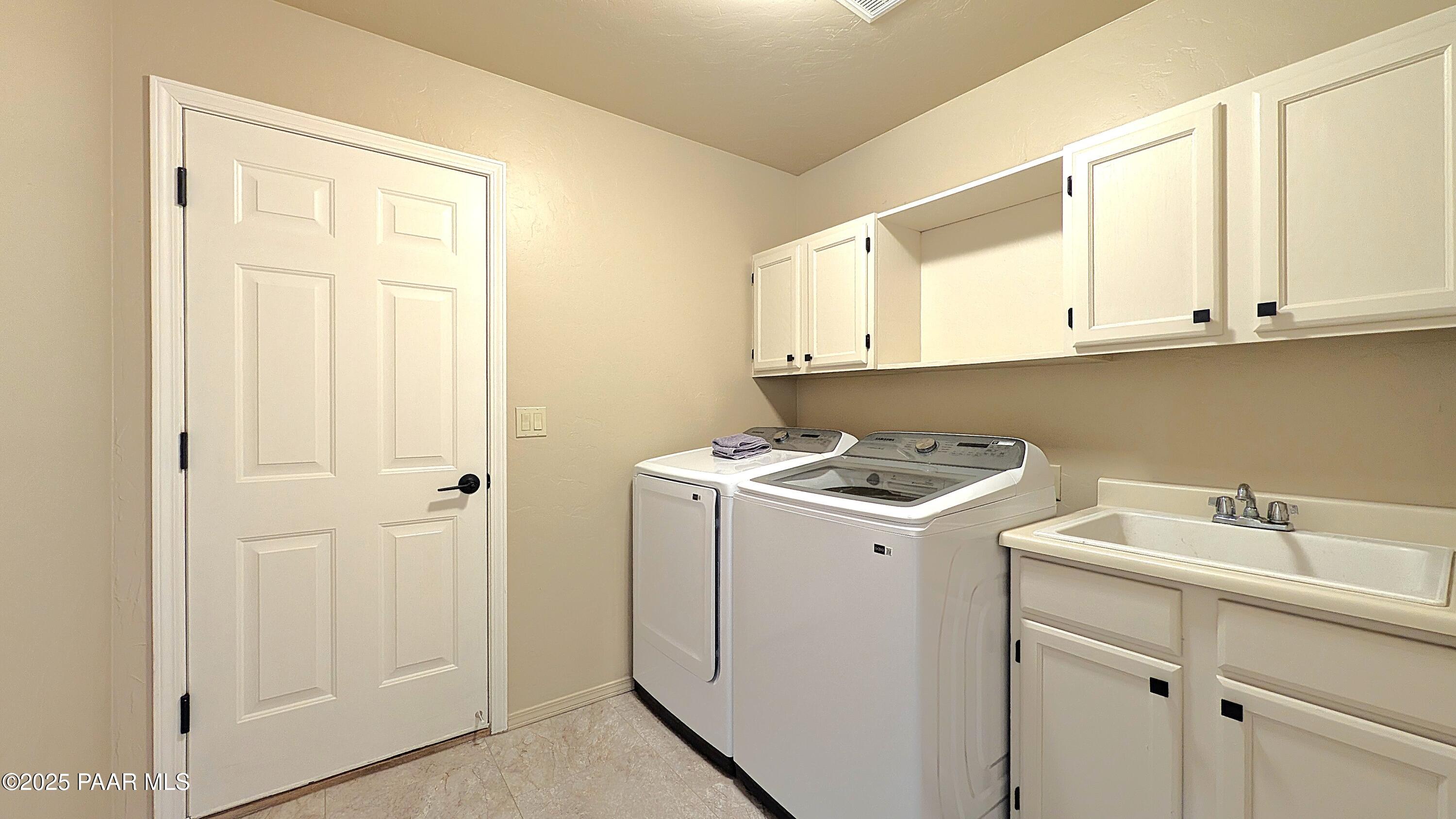 4911 Hornet Drive Prescott, AZ 86301 - Photo 18 of 29 a utility room with sink dryer and washer