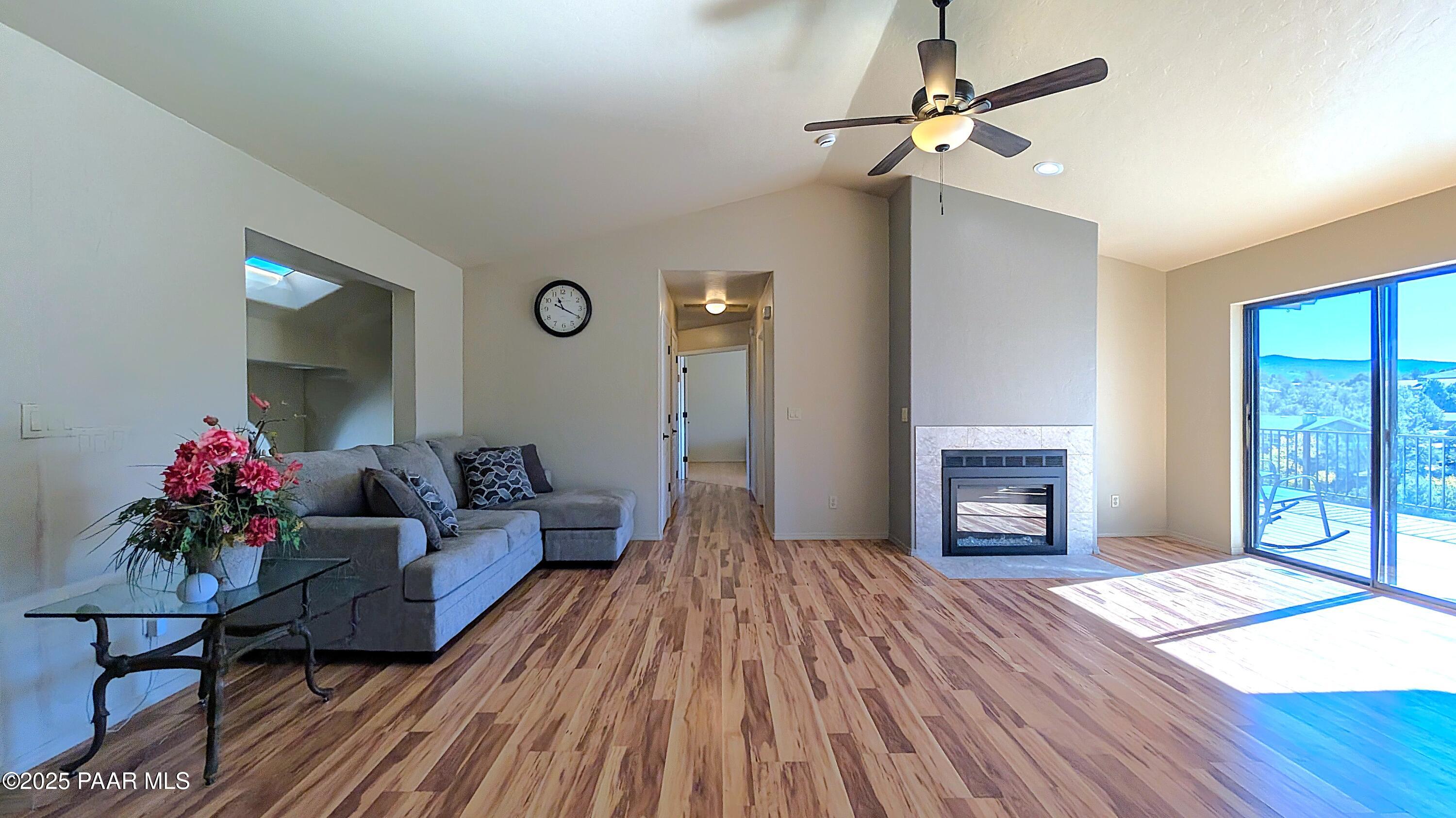4911 Hornet Drive Prescott, AZ 86301 - Photo 2 of 29 a living room with furniture and a fireplace