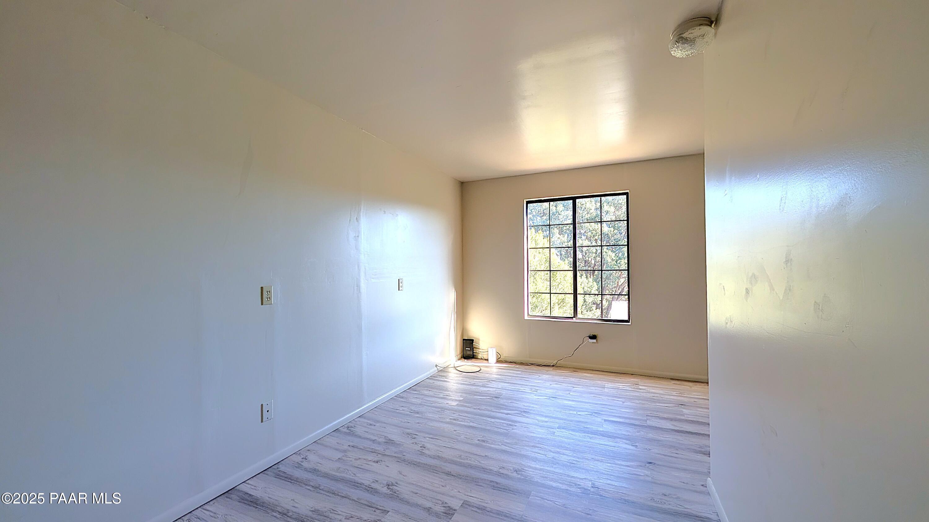 4911 Hornet Drive Prescott, AZ 86301 - Photo 21 of 29 a view of empty room with wooden floor and fan