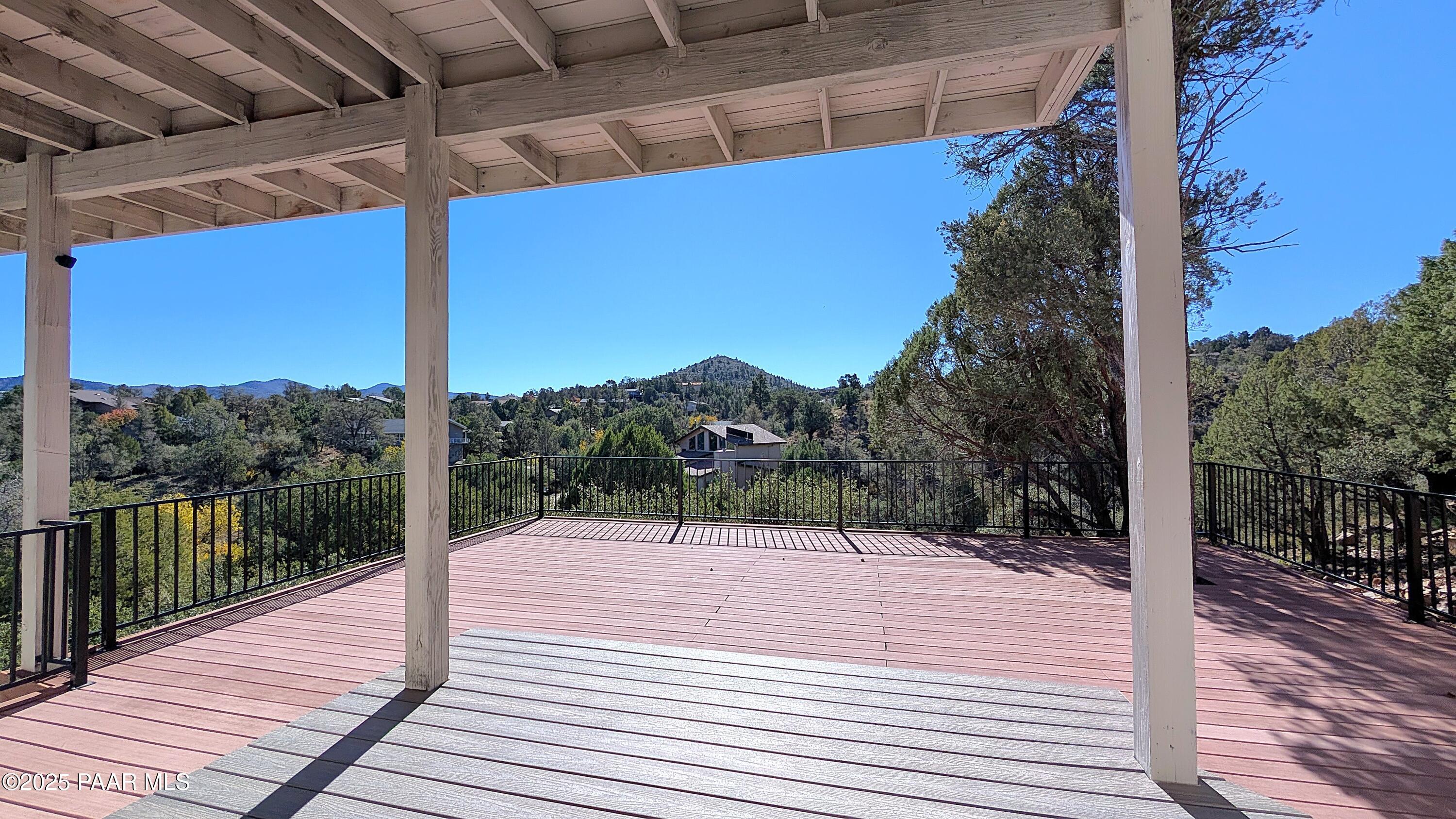 4911 Hornet Drive Prescott, AZ 86301 - Photo 25 of 29 a wooden deck with sunset view