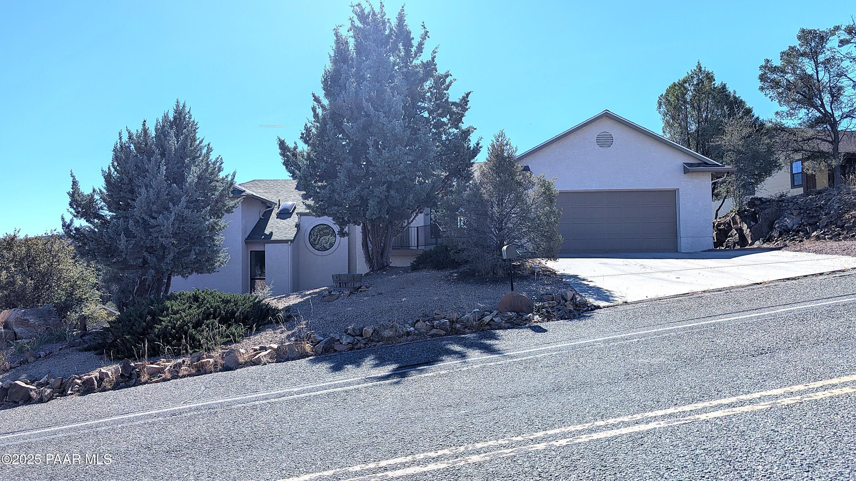 4911 Hornet Drive Prescott, AZ 86301 - Photo 28 of 29 a front view of a house with a yard and garage