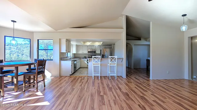 a view of a kitchen and dining room
