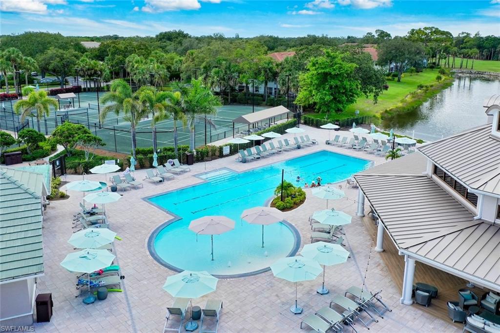 1940 Willow Bend Circle, Unit 102 Naples, FL 34109 - Photo 35 of 39 a view of a swimming pool with a patio
