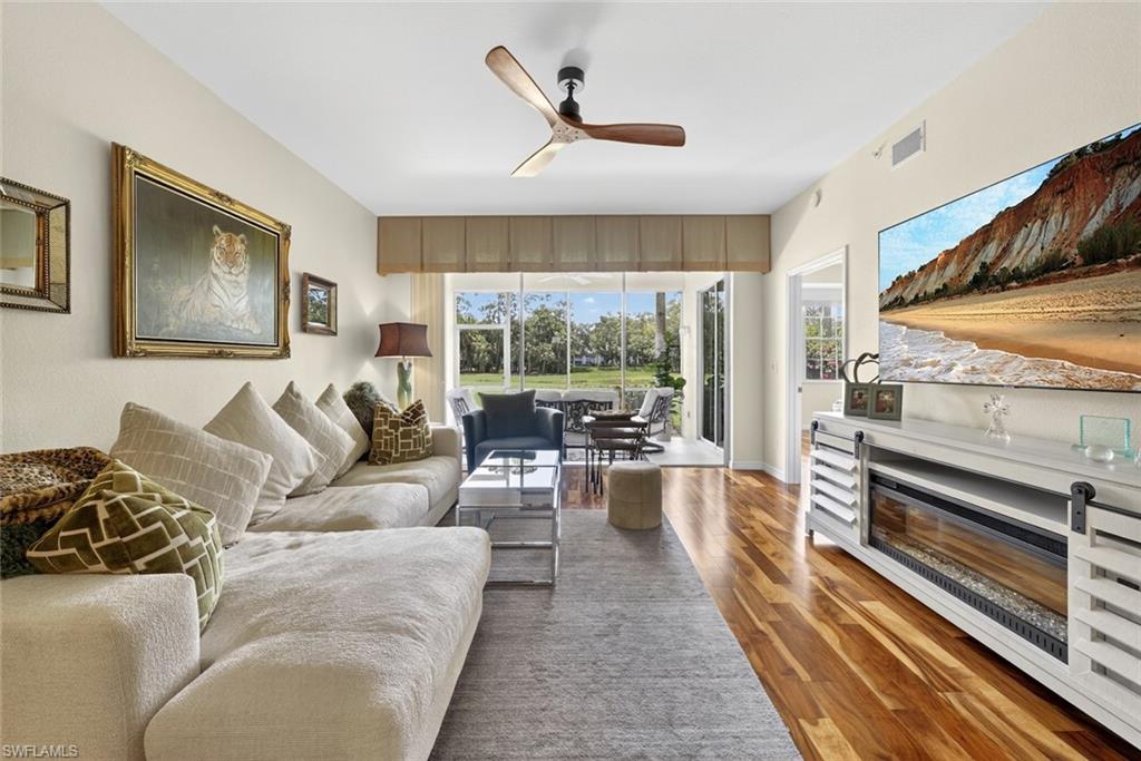 1940 Willow Bend Circle, Unit 102 Naples, FL 34109 - Photo 10 of 39 a living room with furniture