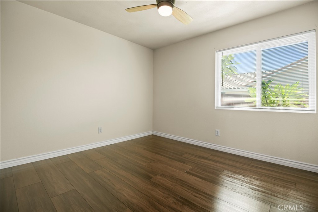13006 August Circle Riverside, CA 92503 - Photo 13 of 19 a view of an empty room with wooden floor and a window