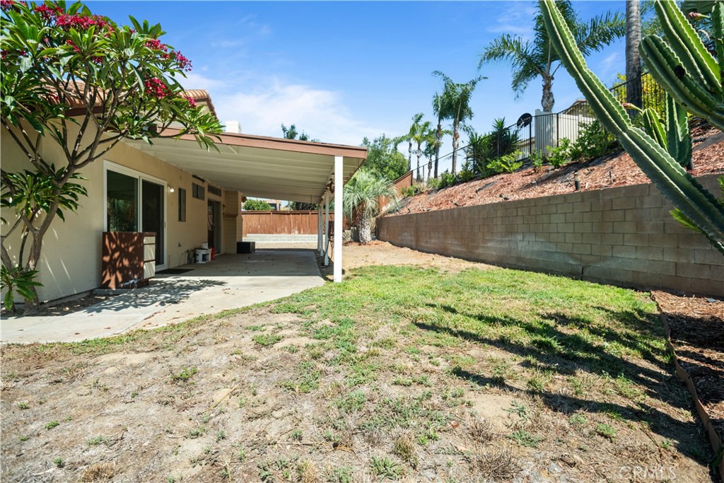 13006 August Circle Riverside, CA 92503 - Photo 17 of 19 a front view of a house with a yard and garage
