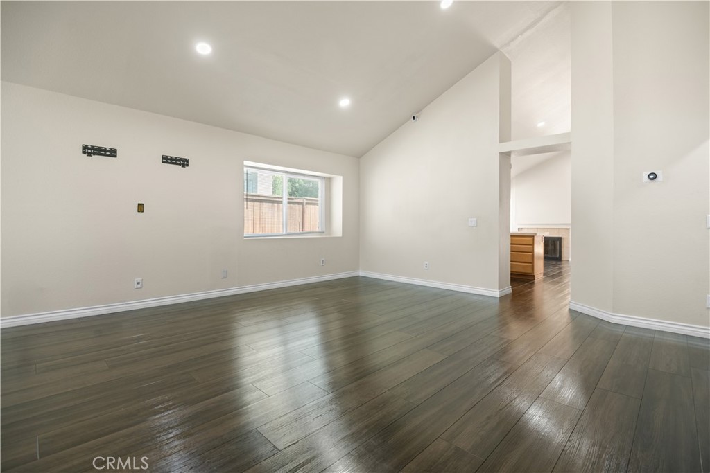 13006 August Circle Riverside, CA 92503 - Photo 3 of 19 an empty room with wooden floor and windows