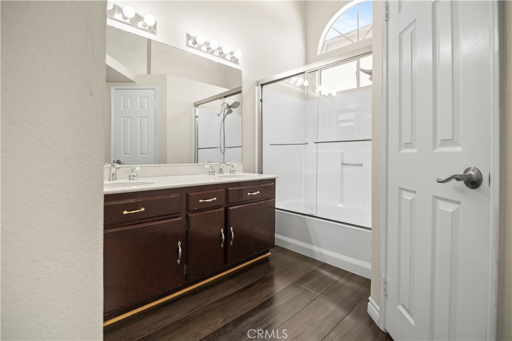 13006 August Circle Riverside, CA 92503 - Photo 7 of 19 a bathroom with a double vanity sink and mirror