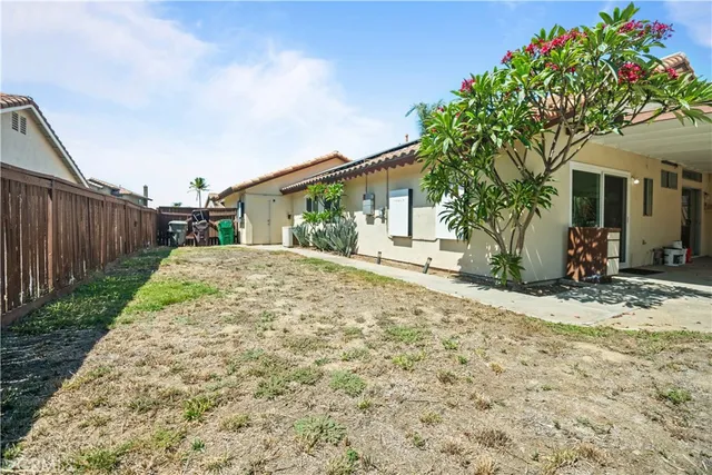 a porch with a tree in front of it