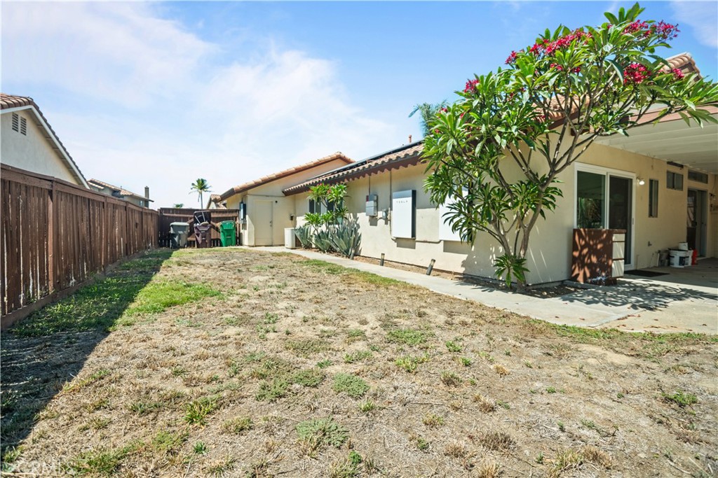 13006 August Circle Riverside, CA 92503 - Photo 9 of 19 a porch with a tree in front of it