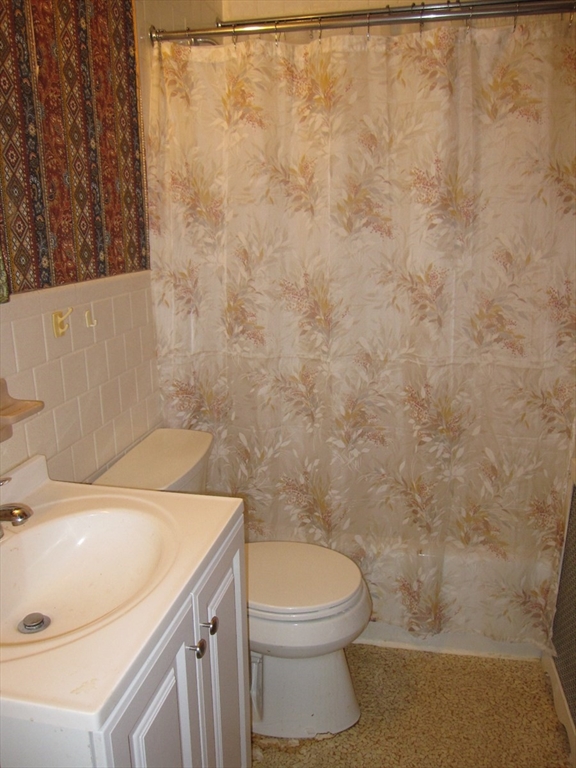 6 Broads Avenue Natick, MA 01760 - Photo 17 of 17 a bathroom with a sink a toilet and shower