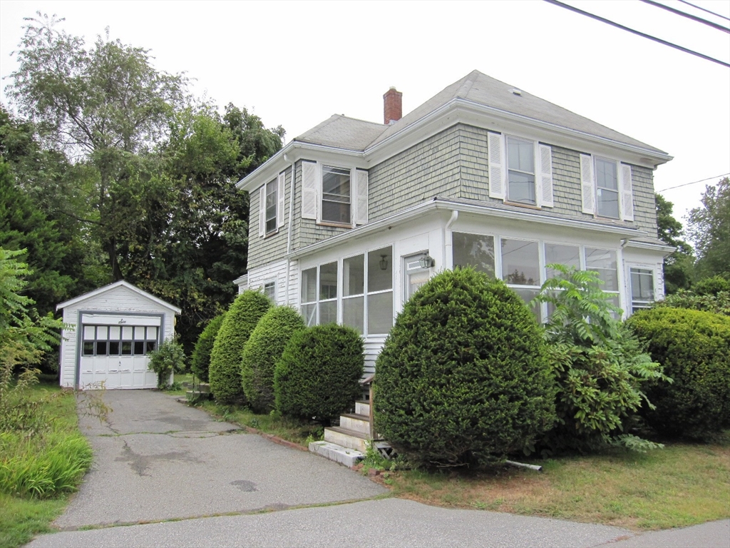 6 Broads Avenue Natick, MA 01760 - Photo 3 of 17 a front view of a house with a garden