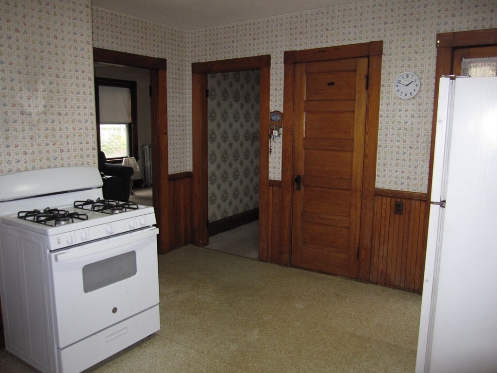 6 Broads Avenue Natick, MA 01760 - Photo 5 of 17 a kitchen with a stove and a cabinet