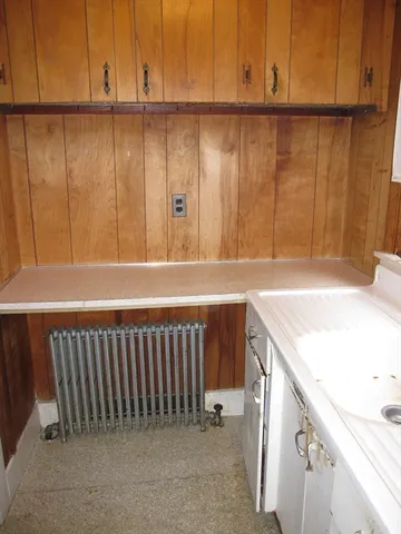 a view of a kitchen with a sink and dishwasher