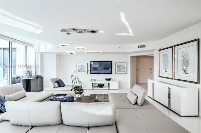 a bathroom with a granite countertop sink mirror vanity and toilet