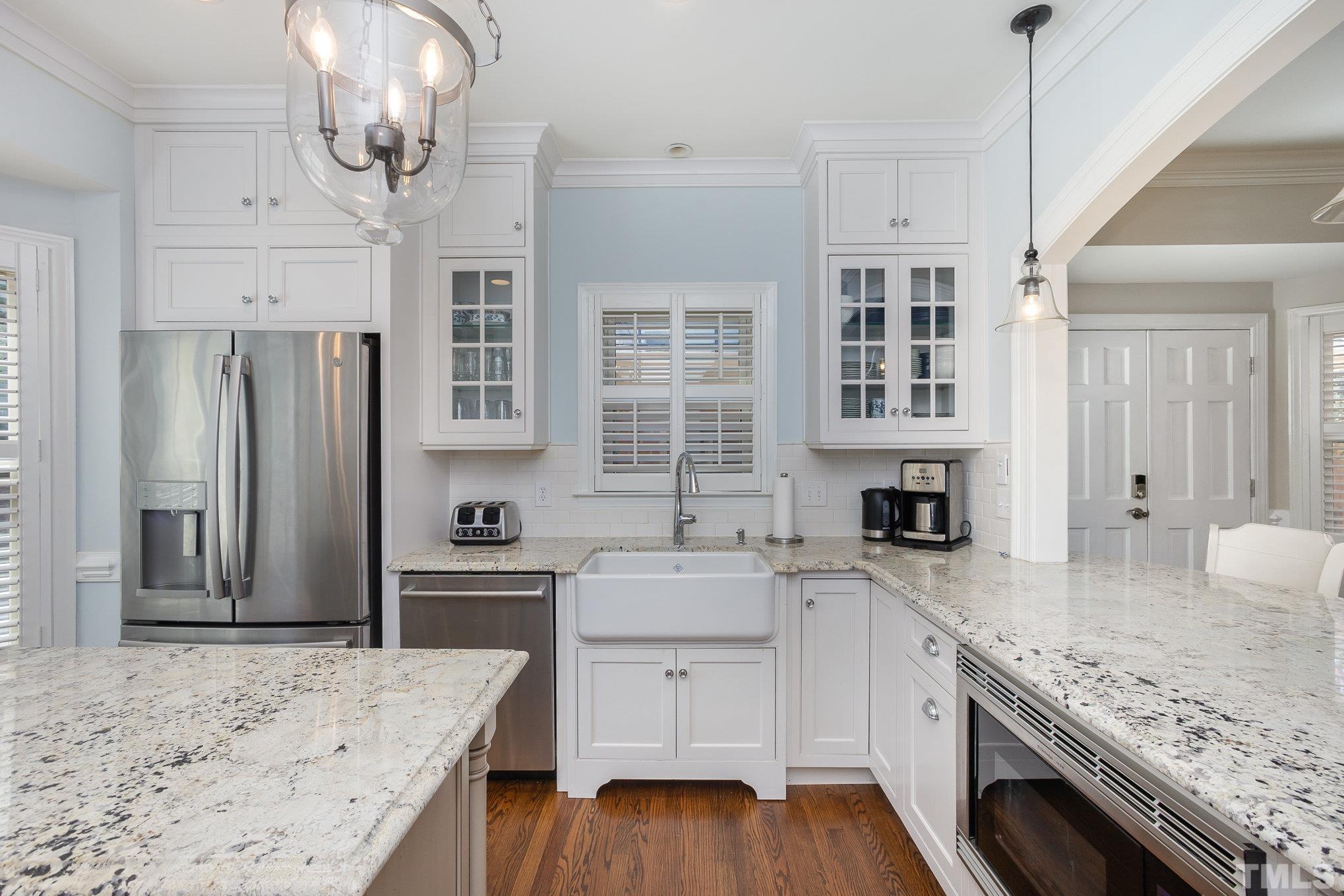 7941 Footman Way Raleigh, NC 27615 - Photo 13 of 41 a kitchen with stainless steel appliances granite countertop a sink stove and refrigerator
