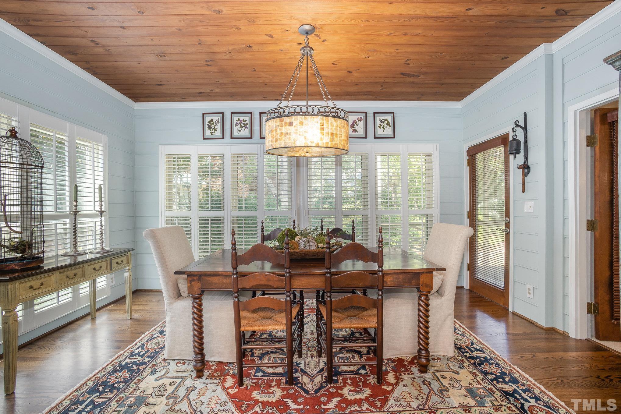 7941 Footman Way Raleigh, NC 27615 - Photo 18 of 41 a view of a dining room with furniture window and wooden floor