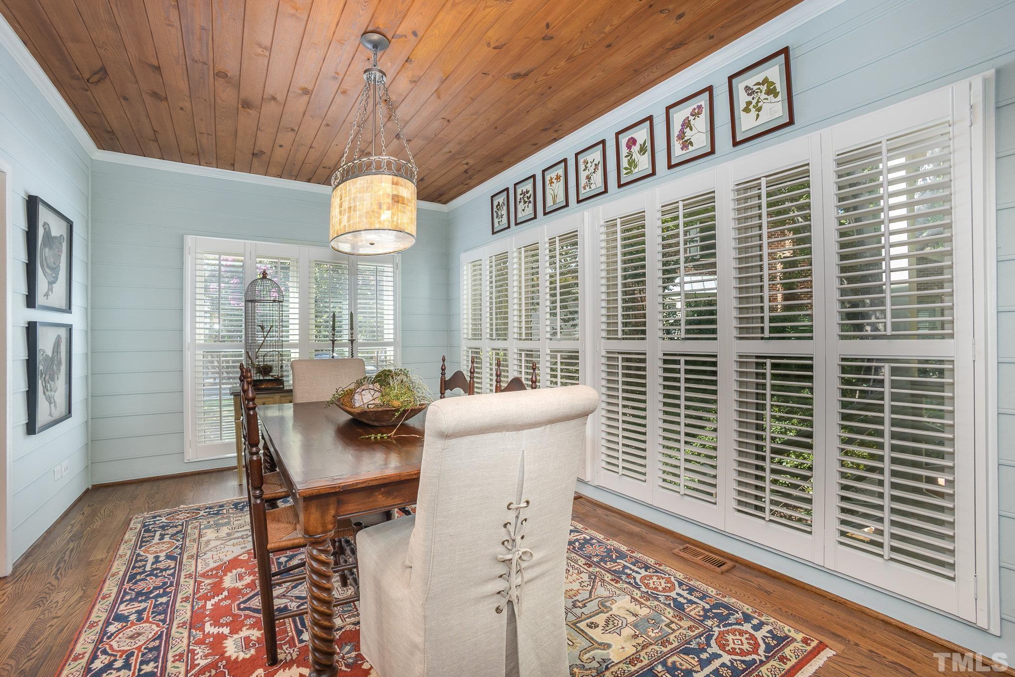 7941 Footman Way Raleigh, NC 27615 - Photo 19 of 41 a view of a dining room with furniture window and wooden floor
