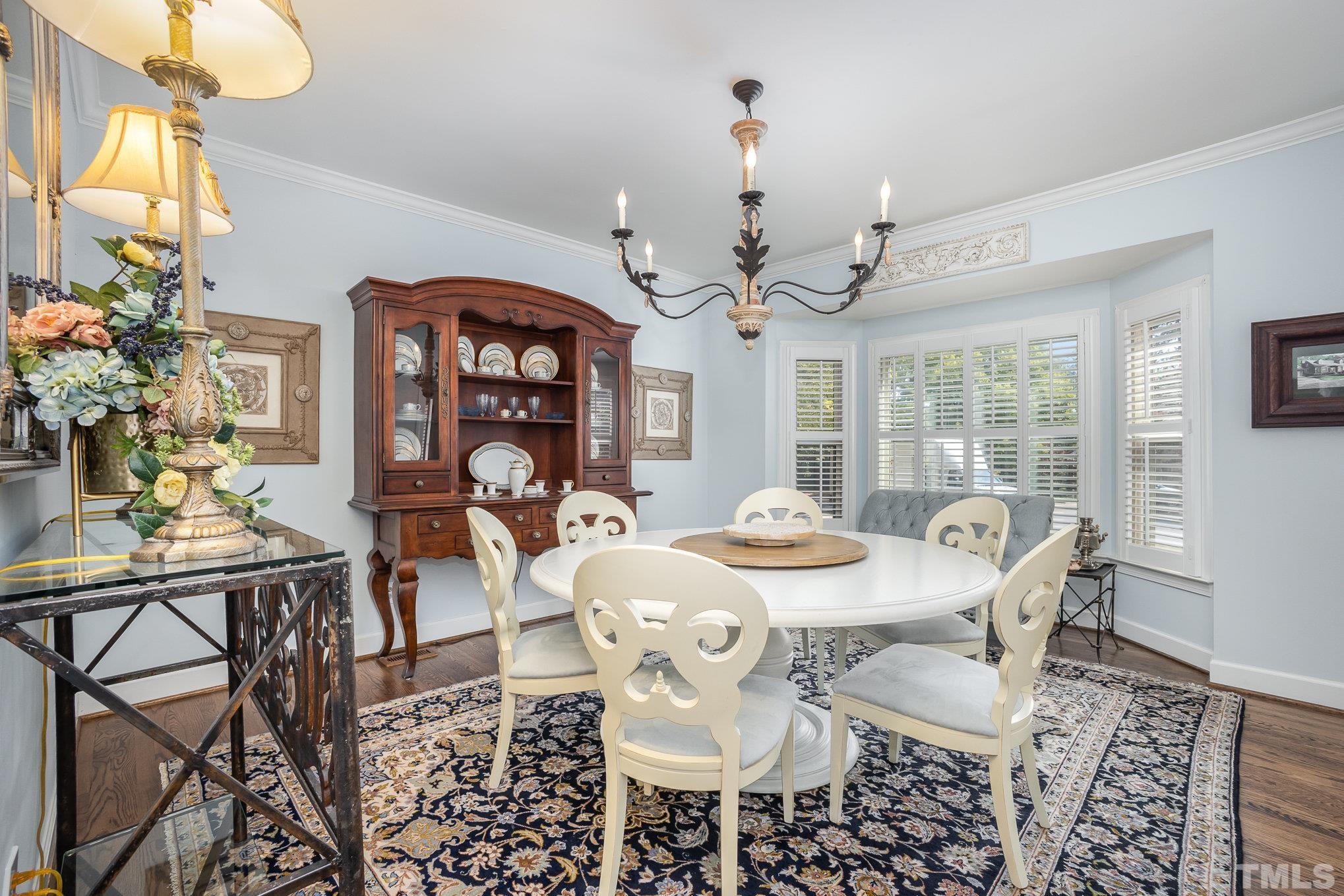 7941 Footman Way Raleigh, NC 27615 - Photo 21 of 41 a view of a dining room with furniture window and outside view