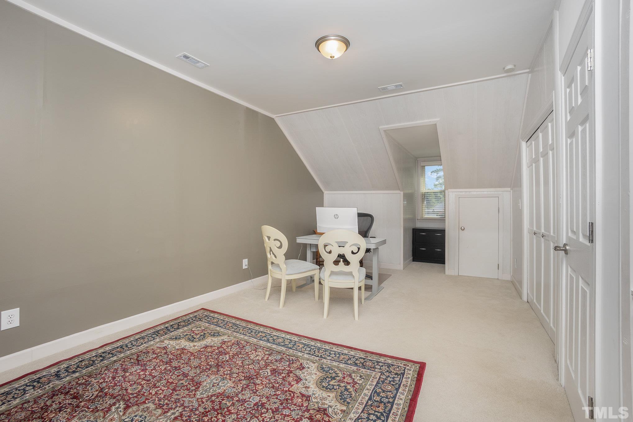 7941 Footman Way Raleigh, NC 27615 - Photo 29 of 41 a living room with furniture and a rug