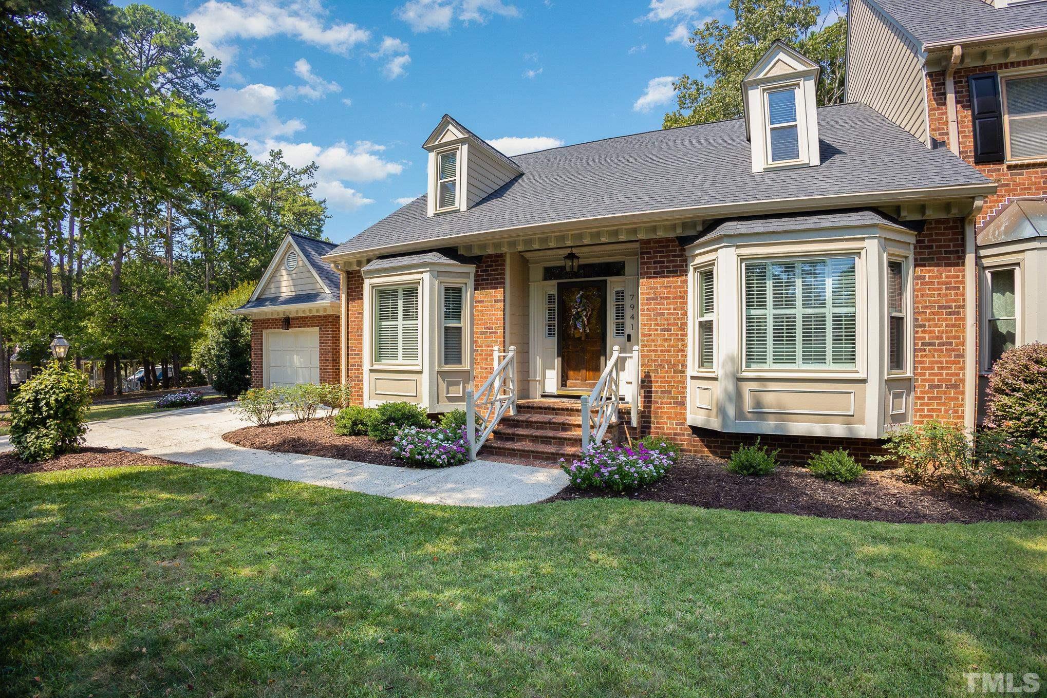 7941 Footman Way Raleigh, NC 27615 - Photo 3 of 41 a front view of a house with porch