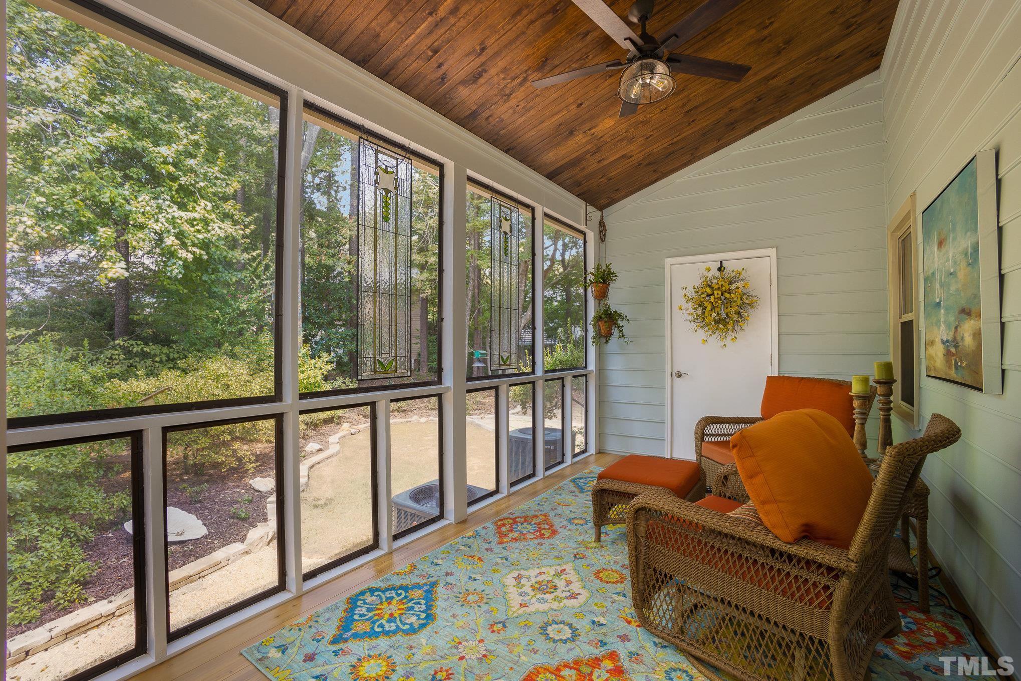 7941 Footman Way Raleigh, NC 27615 - Photo 33 of 41 a living room with furniture and a floor to ceiling window