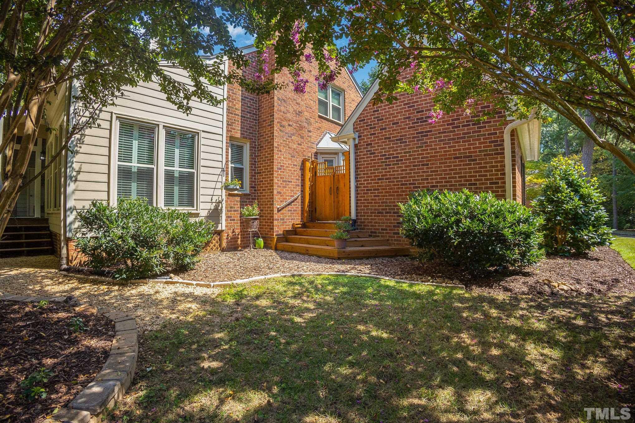 7941 Footman Way Raleigh, NC 27615 - Photo 36 of 41 a front view of a house with a yard