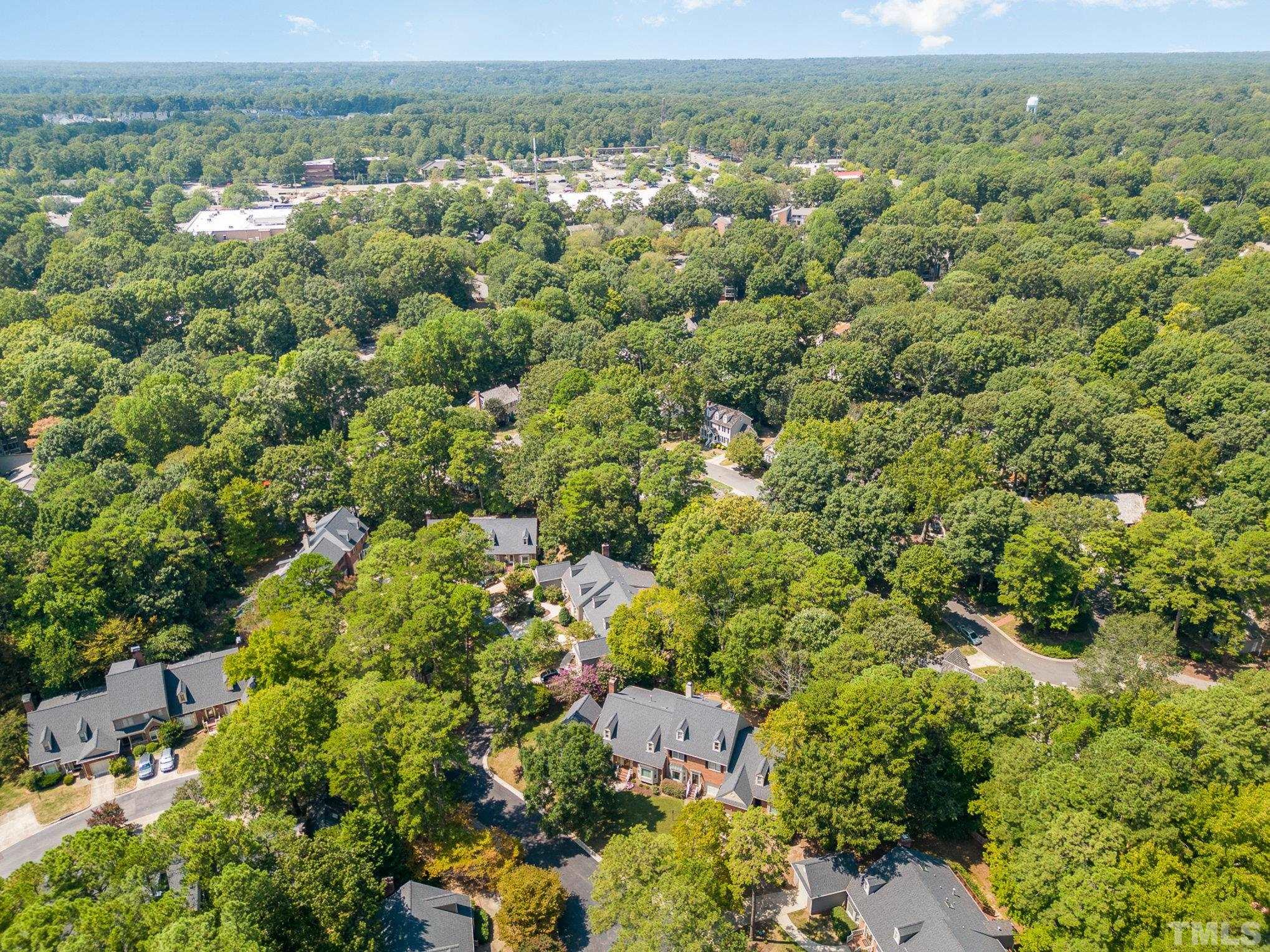 7941 Footman Way Raleigh, NC 27615 - Photo 40 of 41 an aerial view of a houses with a lush green hillside