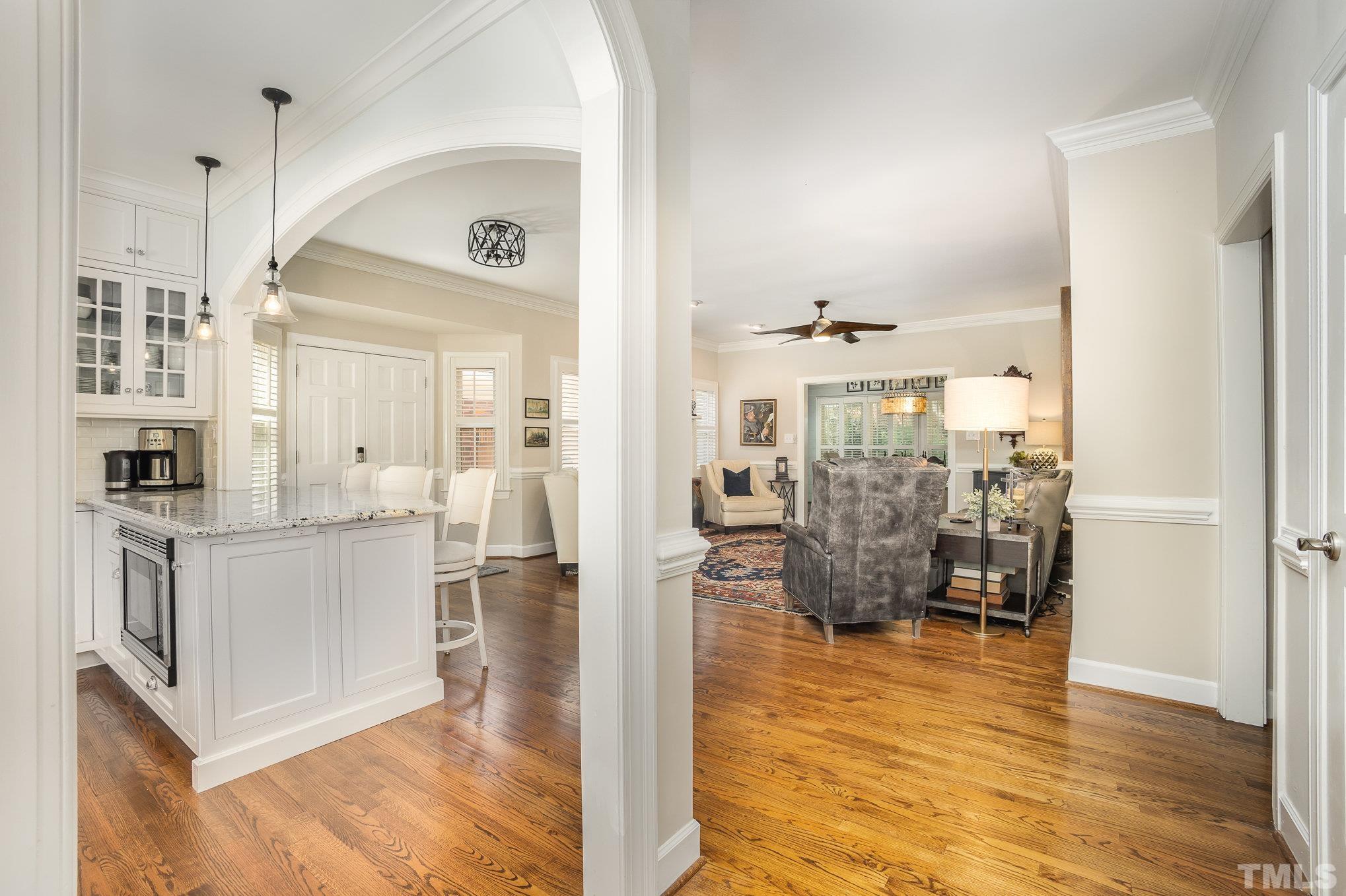 7941 Footman Way Raleigh, NC 27615 - Photo 8 of 41 a view of kitchen with furniture and wooden floor