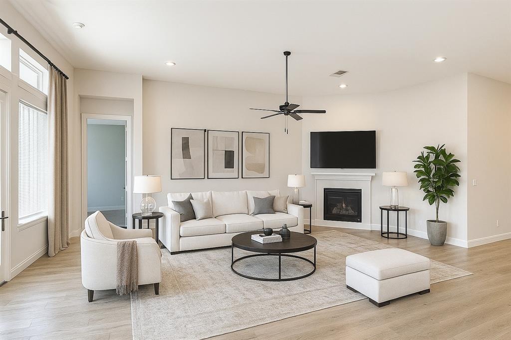 1100 Shoreline Ridge Court Little Elm, TX 75068 - Photo 1 of 1 a living room with furniture and a fireplace