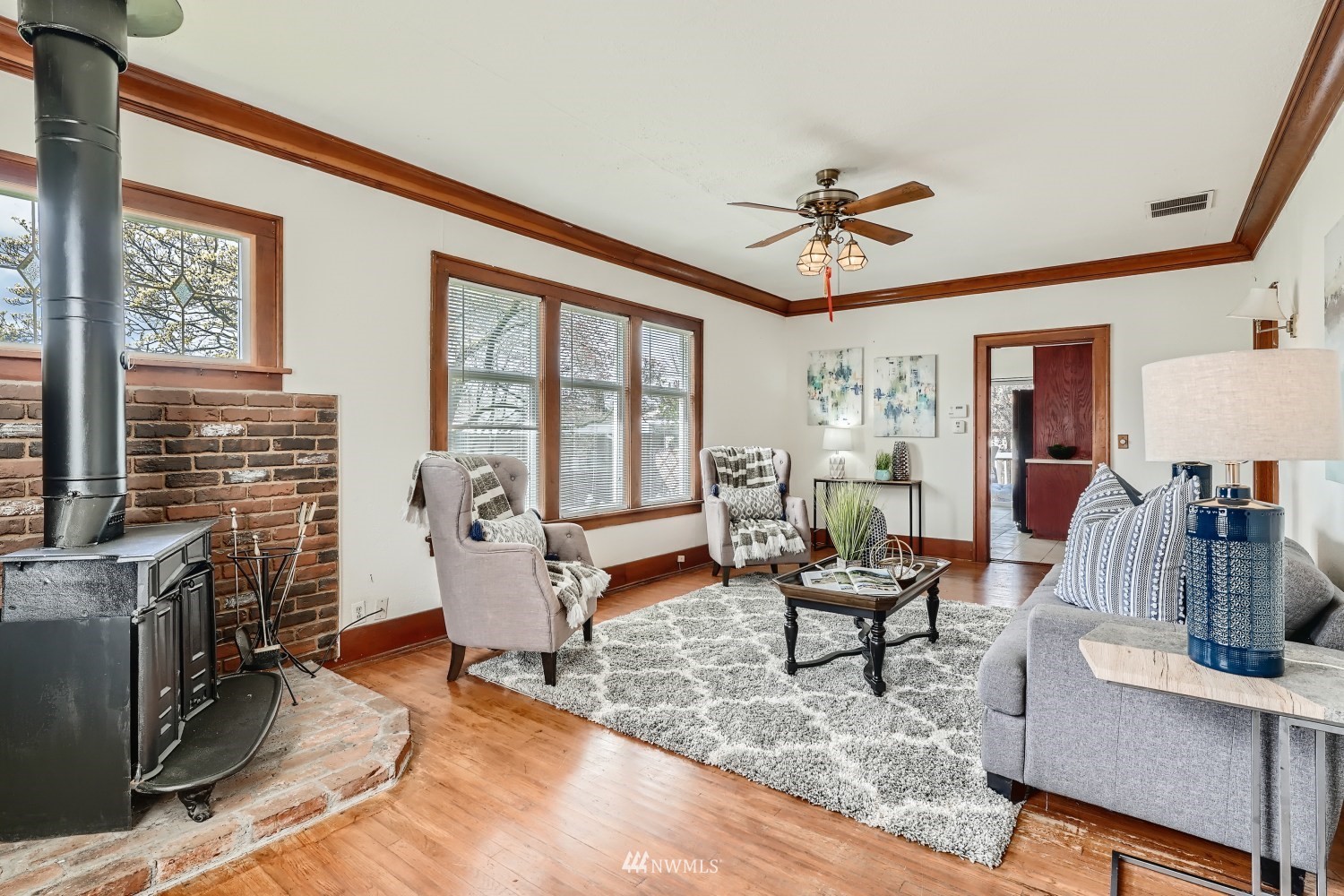 315 Wells Avenue North Renton, WA 98057 - Photo 3 of 28 a living room with furniture and a fireplace