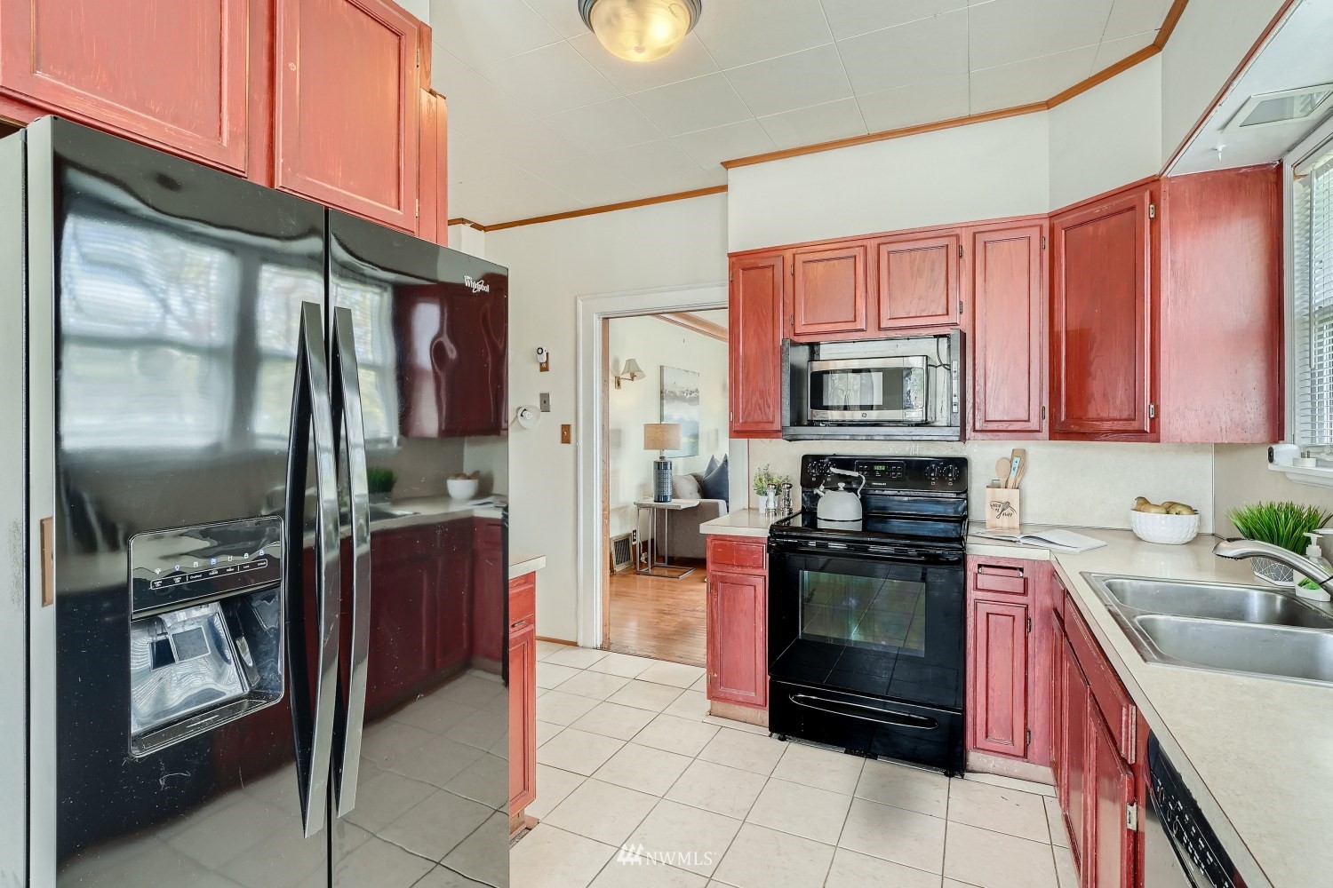 315 Wells Avenue North Renton, WA 98057 - Photo 9 of 28 a kitchen with stainless steel appliances granite countertop a refrigerator stove and sink