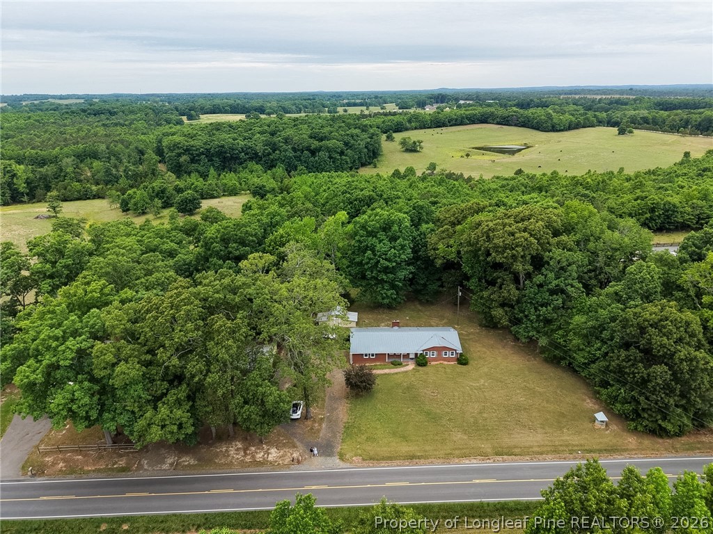 3384 Goldston Glendon Road Goldston, NC 27252 - Photo 31 of 47 an aerial view of a house with a yard and lake view